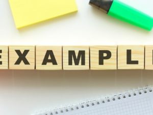 wooden-cubes-with-word-example_284815-518
