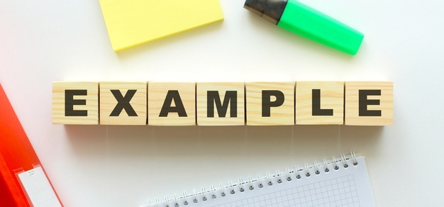 wooden-cubes-with-word-example_284815-518